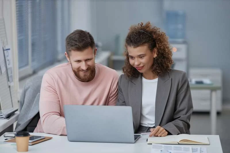 two young economists in smart casualwear looking a 2023 07 19 19 34 01 utc 1