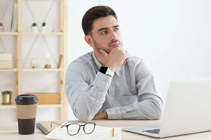 young man spending time in office trying to find s 2021 12 16 19 19 09 utc 1